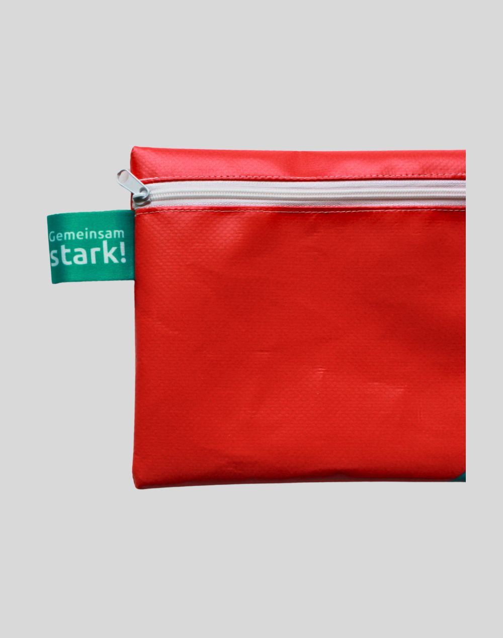 Upcycled A5 pouch made from 2024 Winter Games banner material