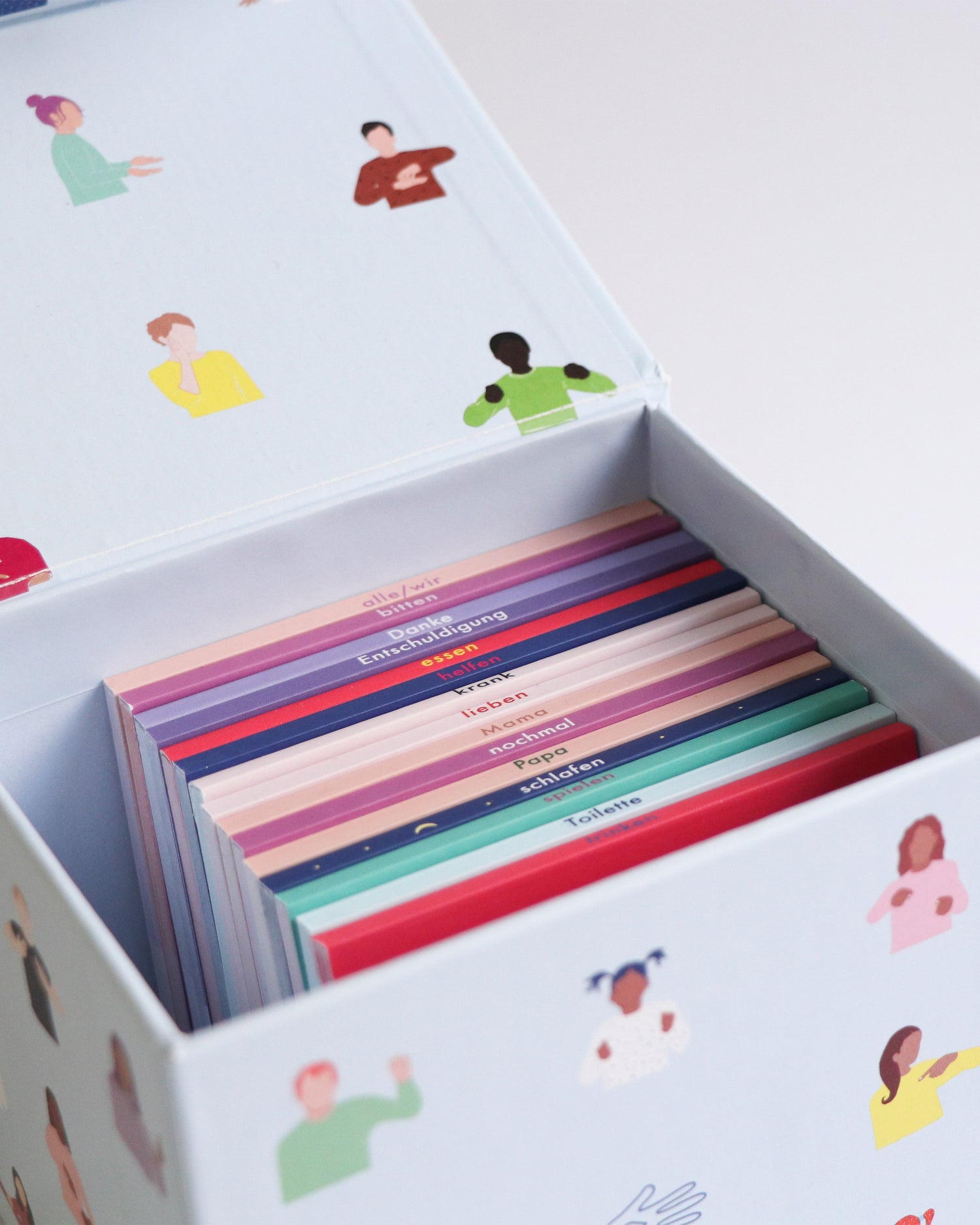 Nahaufnahme geöffnete Box mit a Talking Hands Daumenkino Bllenüchern