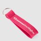 Schlüsselanhänger in pink mit #ZusammenUnschlagbar Schriftzug weiß vorne