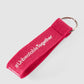 Schlüsselanhänger in pink mit weißem #UnbeatableTogether Schriftzug hinten